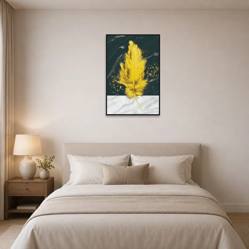 Yellow feather on a marble and dark canvas adding warmth to a serene bedroom.